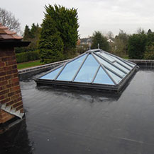 rubber membrane installed on roof around pyramid skylight